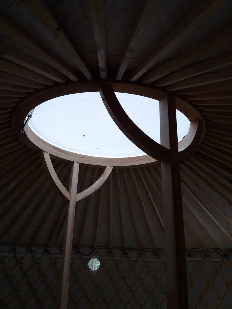 Yurt interior structure: oval roof window and crown ring seen from inside